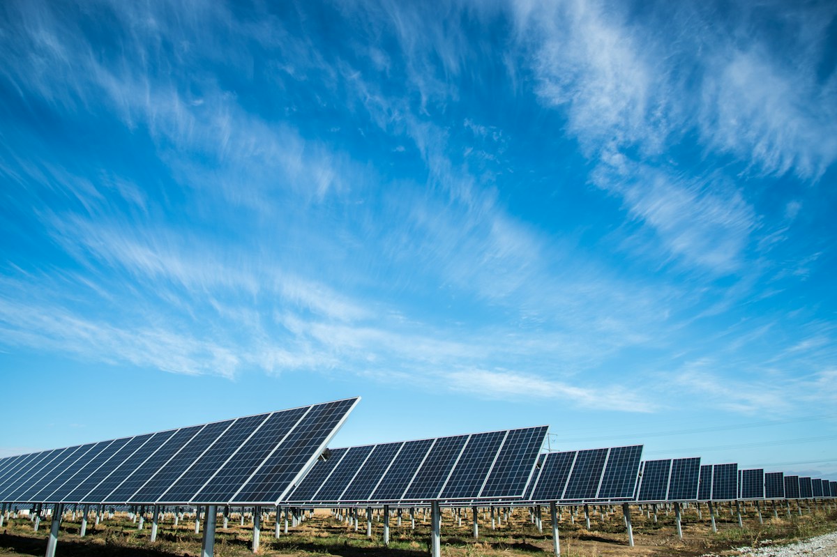 Solar panels harvesting energy under a clear sky